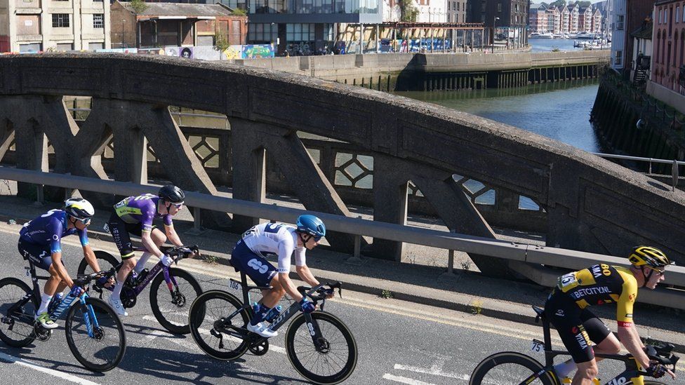 Cyclists crossing a bridge over River Orwell in Ipswich