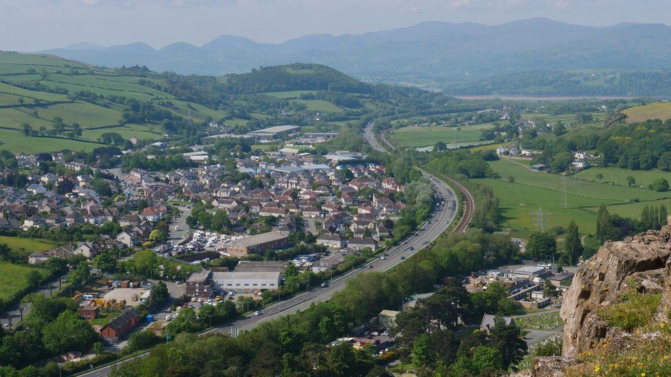 The A55 by Mochdre village and a view of the Snowdonia mountains