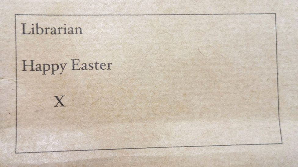 A brown envelope with the words "Librarian Happy Easter X" printed on it