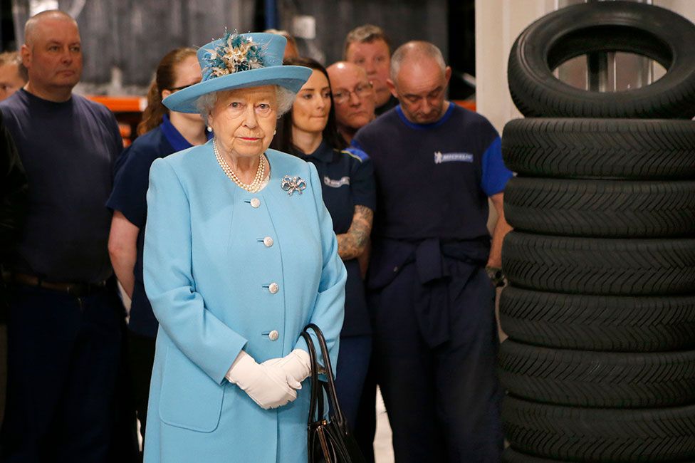 Queen Elizabeth II meets apprentices during a visit to the training school and workshop at the Michelin tyre factory in Dundee.