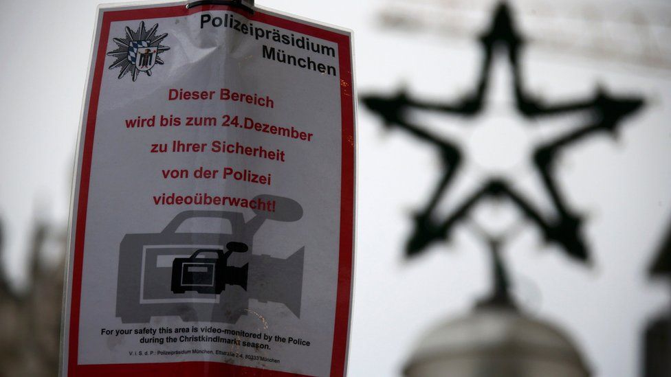 A police placard informs visitors that this Christmas market is under video surveillance in downtown Munich, Germany, 21 December 2016