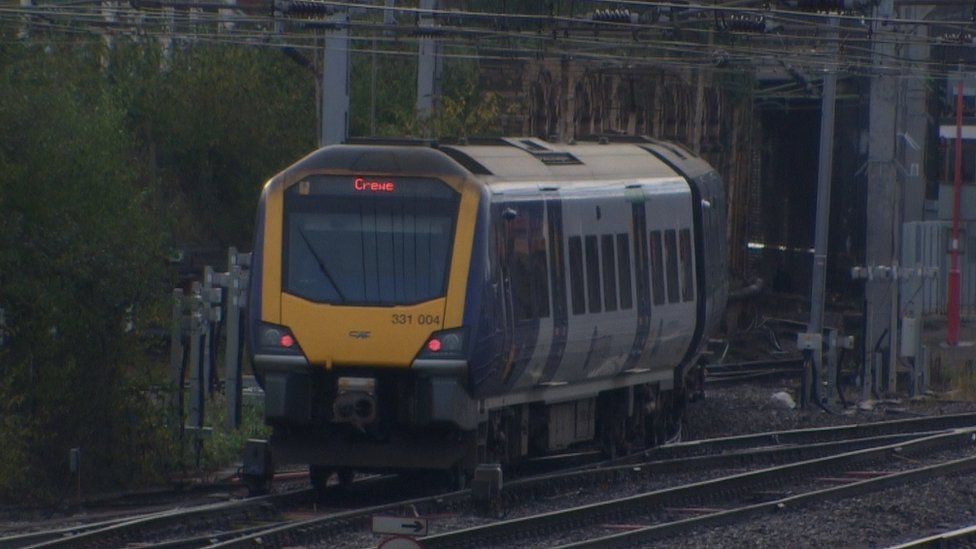 A train that says Crewe on it, arriving into Crewe Station