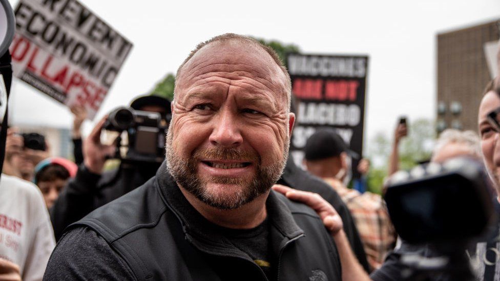 Infowars founder Alex Jones interacts with supporters at the Texas State Capital building on April 18, 2020