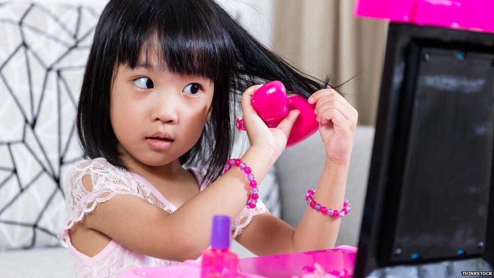 Girl playing with make up