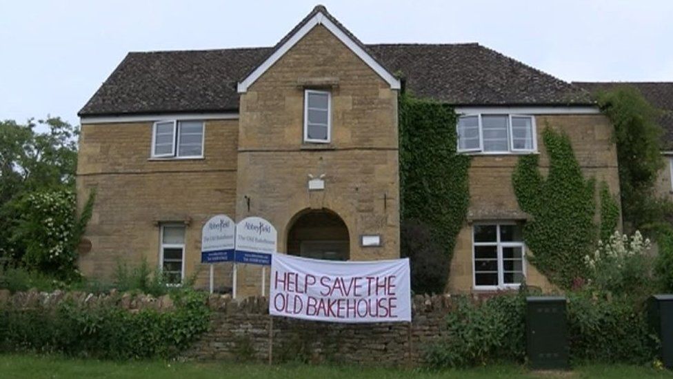 The Old Bakehouse in Chipping Norton with a banner outside