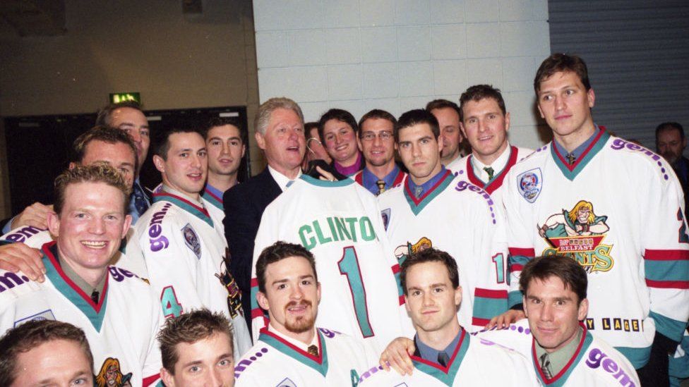 USA President Bill Clinton meets and is presented with a shirt by the Belfast Giants Ice Hockey team during a visit to the Odyssey Arena, Belfast, Northern Ireland.