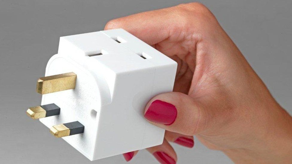 Four way plug adapter