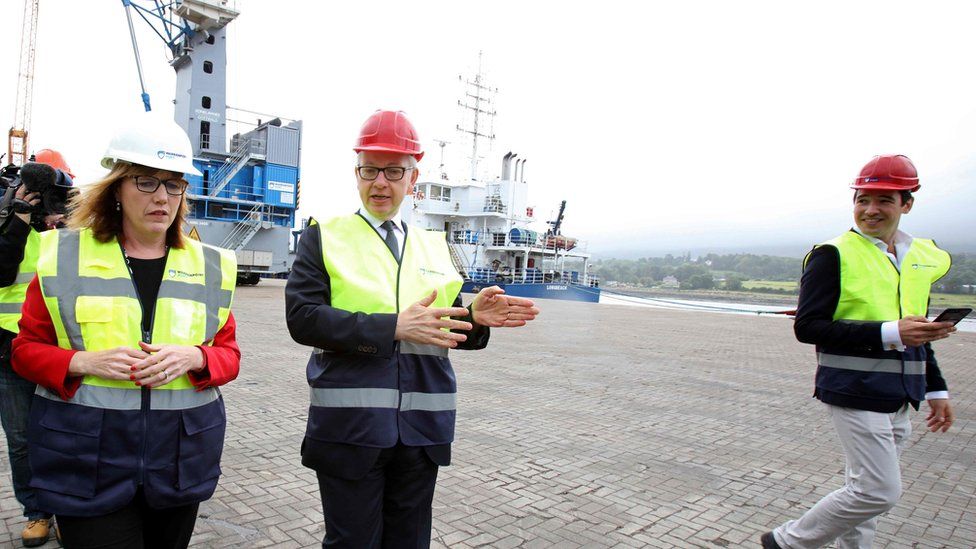 Michael Gove with Clare Guinness, CEO of Warrenpoint Harbour, in August 2019