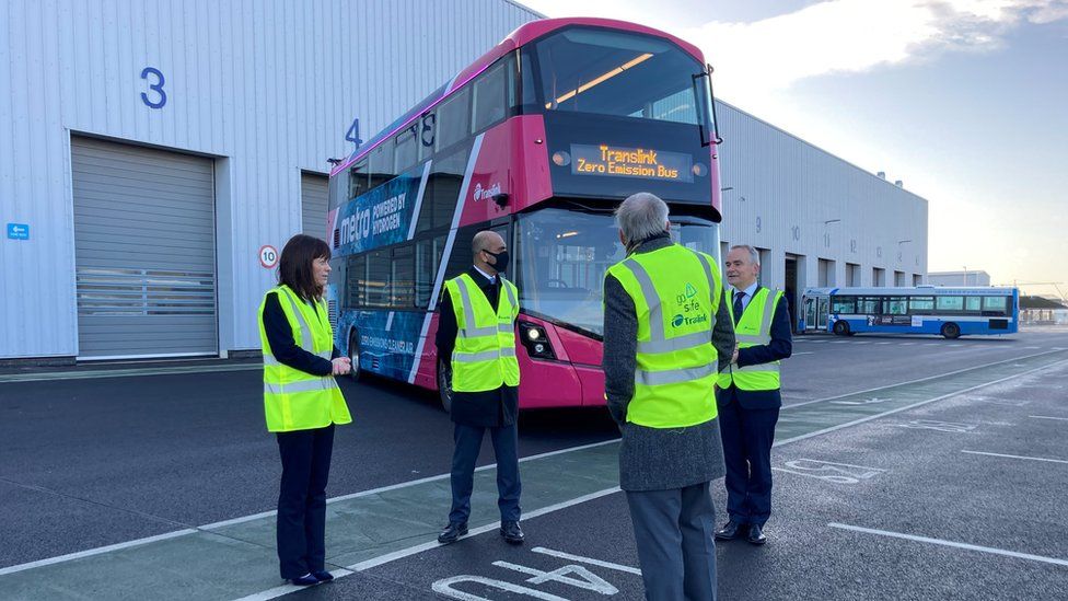 Minister for Infrastructure Nichola Mallon and Translink staff with one of the new hydrogen-powered buses