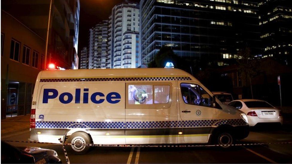 A police van blocks a street outside the New South Wales (NSW) state police headquarters located in the Sydney suburb of Parramatta, Australia, on 2 October 2015.