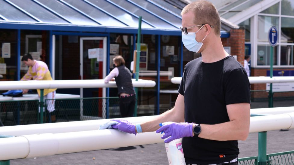 Staff wiping down surfaces at Leicester Racecourse
