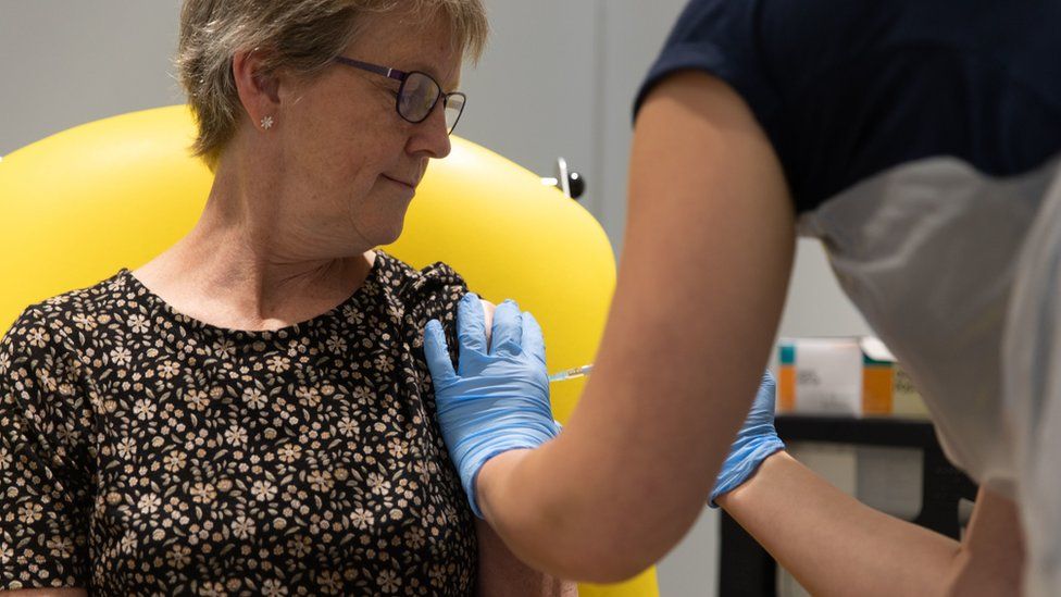 A woman getting the AstraZeneca/Oxford University vaccine