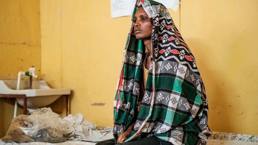 This November 20, 2020 photograph shows a survivor of the November 9, 2020 Mai Kadra massacre, seating in a bed at the Gondar University Hospital, in the city of Gonda