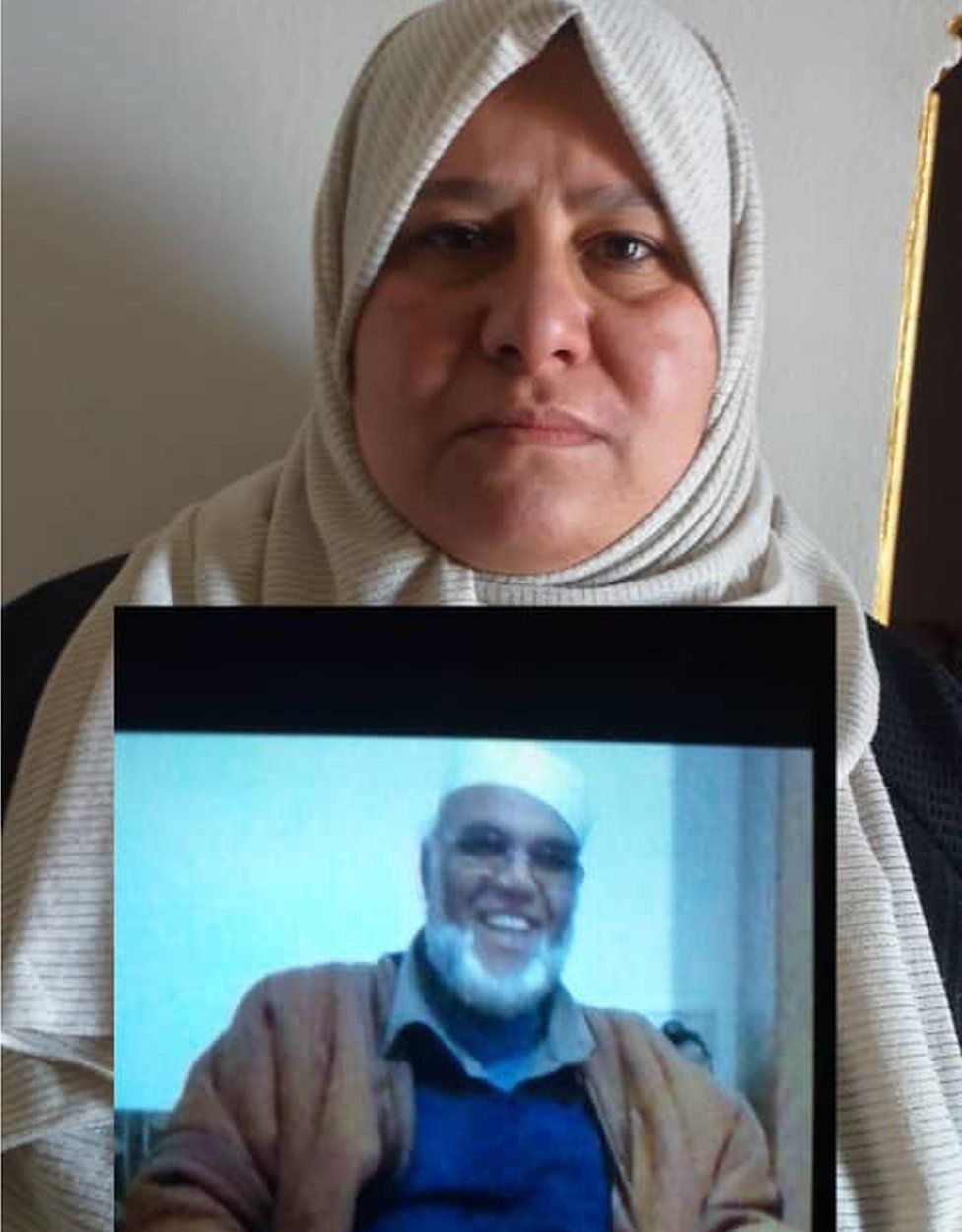 Hanan Abu-Kleish with photograph of one of her missing uncles