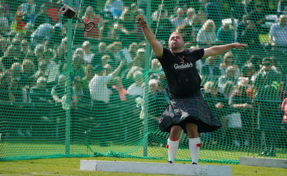 A competitor tosses the hammer during the Braemar Gathering