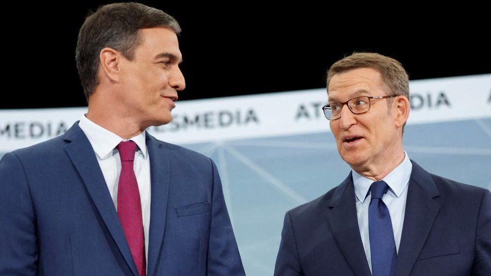 Spanish People's Party candidate Alberto Nunez Feijoo and Spain's Prime Minister and Socialist candidate Pedro Sanchez talk before a televised debate