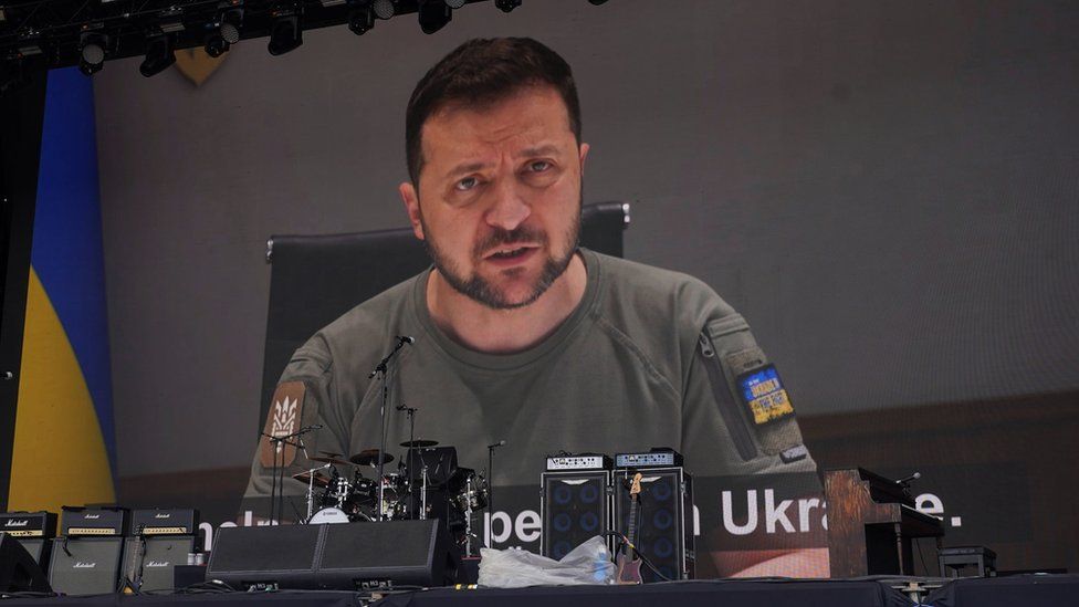 Ukrainian President Volodymyr Zelensky shown to the crowd at the Other Stage during the Glastonbury Festival