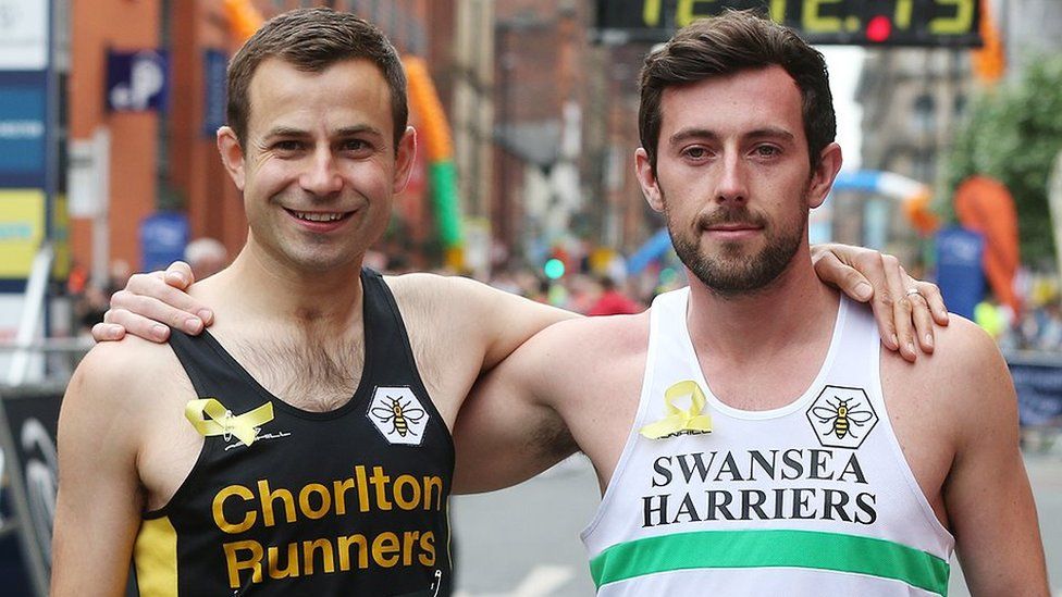 David Wyeth and Matthew Rees in their running gear at the end of the Great Manchester Run in 2017