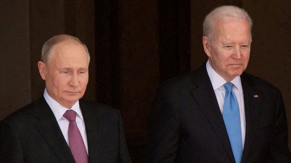 Vladimir Putin, left, and Joe Biden, right, both dressed in dark business suits