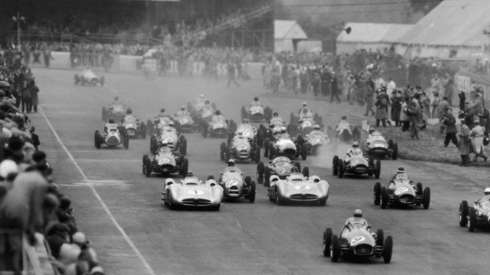 BRM driver Frolian Gonzalez leading the pack at the 1954 Grand Prix, followed close behind by Stirling Moss and Mike Hawthorn.