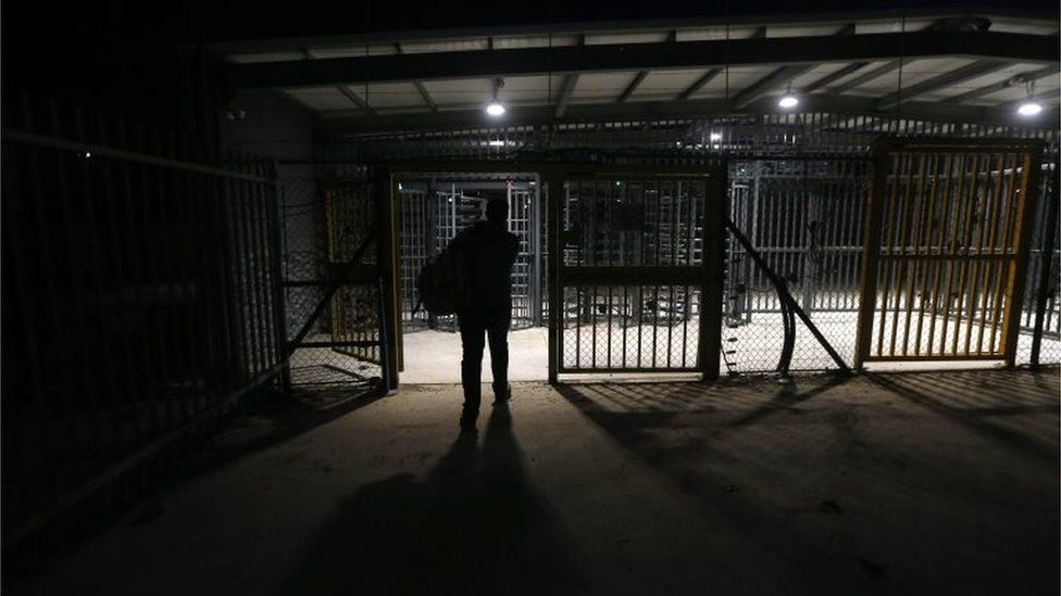 Palestinian worker heading through an Israeli checkpoint in the West Bank (file photo)