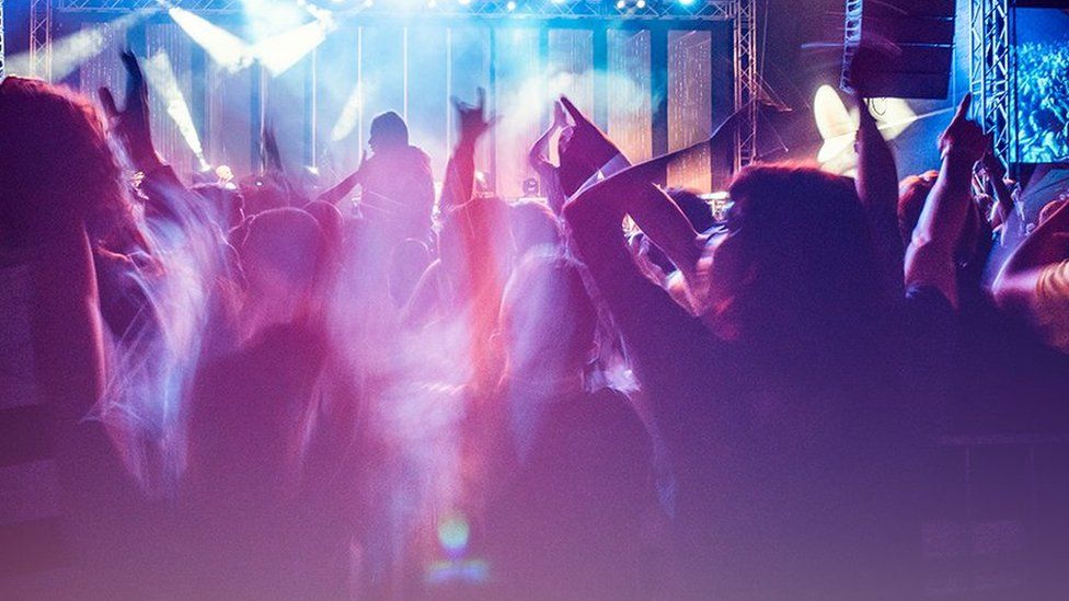 Stock image of people dancing in a club