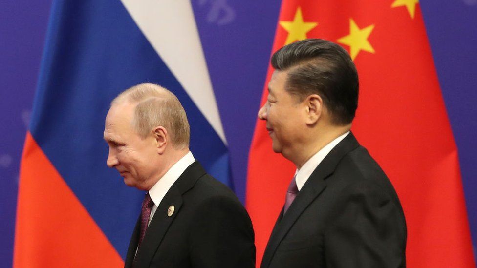 Russian President Vladimir Putin (L) and Chinese President Xi Jinping visit Tsinghua University before their meeting at Friendship Palace in Beijing on April 26, 2019