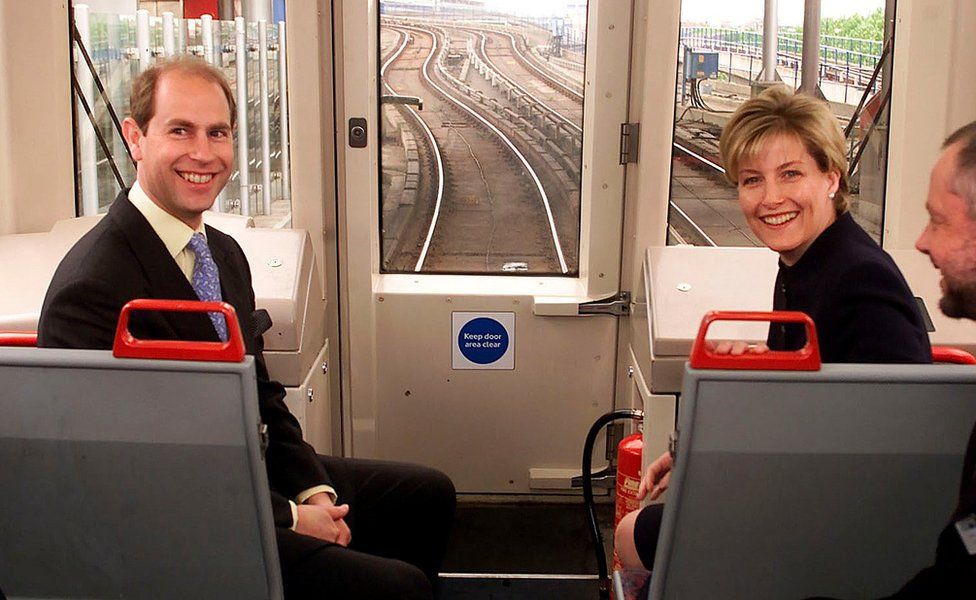 The Earl and Countess of Wessex, Prince Edward and Sophie, travelling at the front of the environmentally-friendly Docklands light railway train