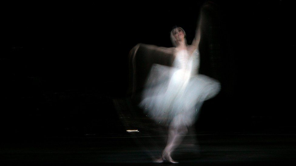 A dancer from The Royal Ballet performs during a dress rehearsal for Swan Lake