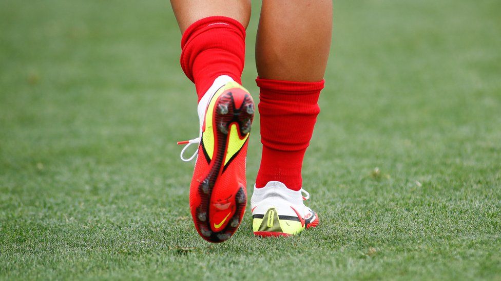 Nike and Adidas urged by MPs to promote female football boots - BBC News