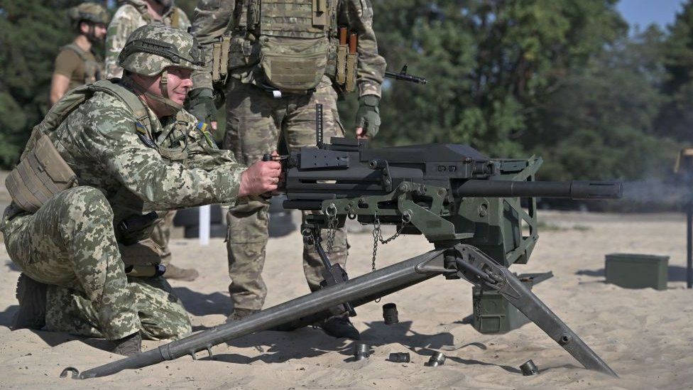 Commander of the Joint Forces the Armed Forces of Ukraine lieutenant general Serhiy Nayev fires a US made MK19 automatic grenade launcher during military training exercises on September 27, 2023
