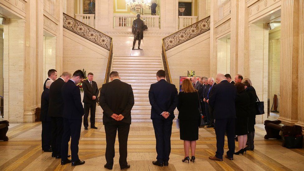 DUP MLAs gather to pray in the great hall before going into the Assembly