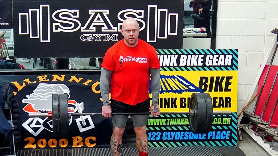 Glen Bailey lifting weights