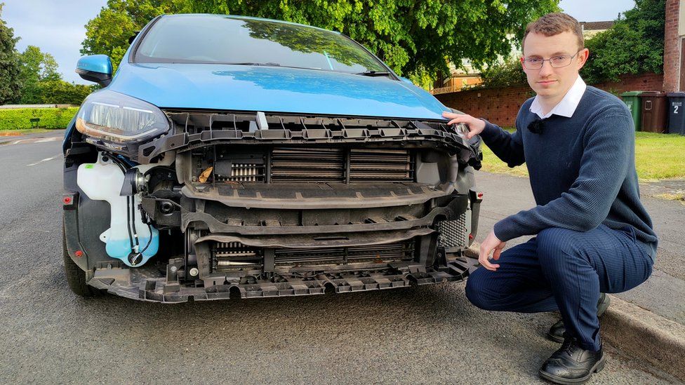 Steven John who is stood beside his car which was stripped over the bank holiday weekend outside his house in Solihull