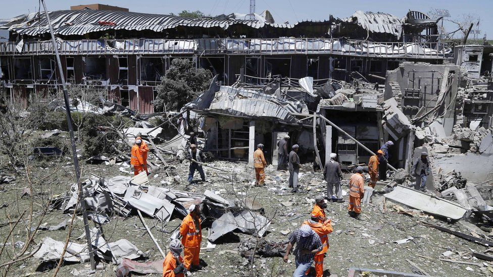 Workers remove debris from a damaged area a day after a suicide bomb attack near foreign embassies in Kabul, Afghanistan, 01 June 2017