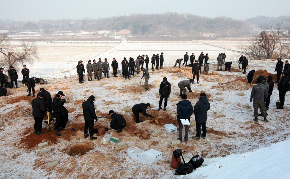 South Korean soldiers excavate the remains of Chinese volunteer soldiers, 2013