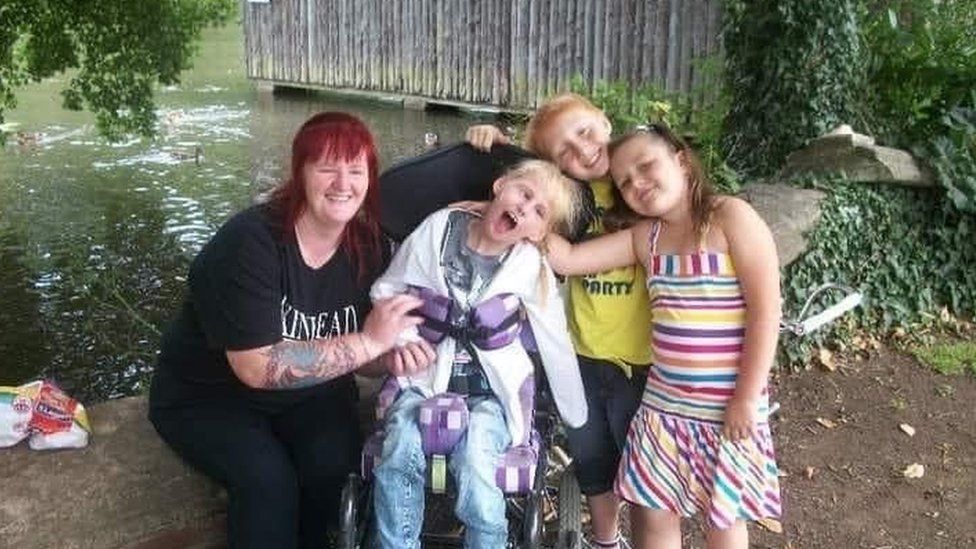 Tegan as a child with her grandmother, brother and aunt