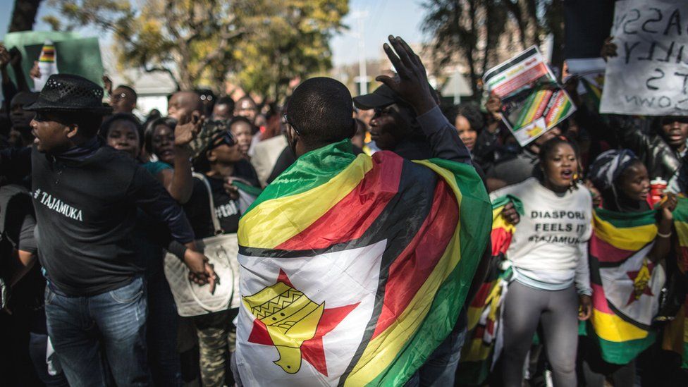 Zimbabwean 'ThisFlag' activists on July 14, 2016 march to the Zimbabwean embassy in Pretoria