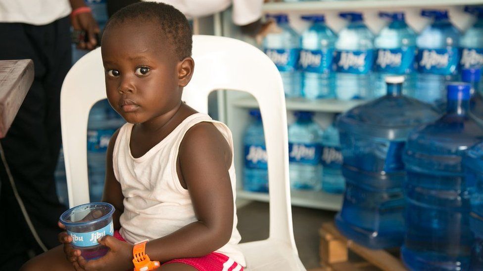 Child drinking Jibu water at a franchise in Entebbe.