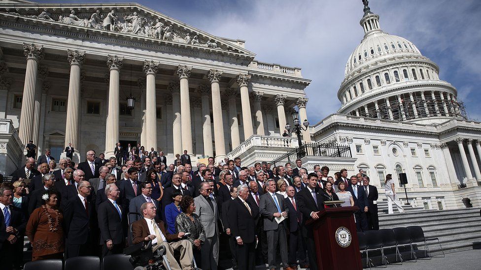 Lawmakers sing "God Bless America" on the steps of the Capitol to mark the 15th anniversary of the attacks