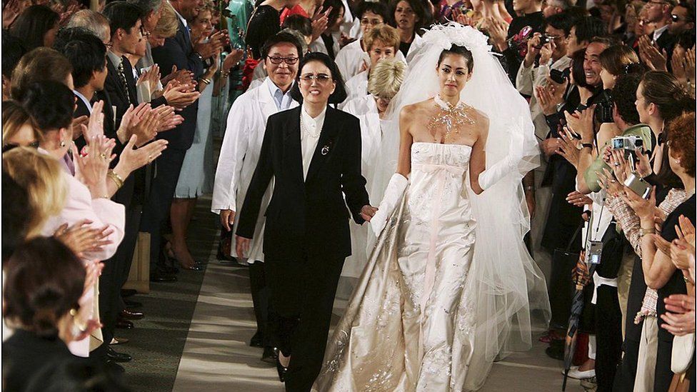 Hanae Mori , Haute Couture fall winter 2004-2005 show in Paris, France On July 07, 2004-Hanae Mori and the bride at the end of the designer's fashion show.