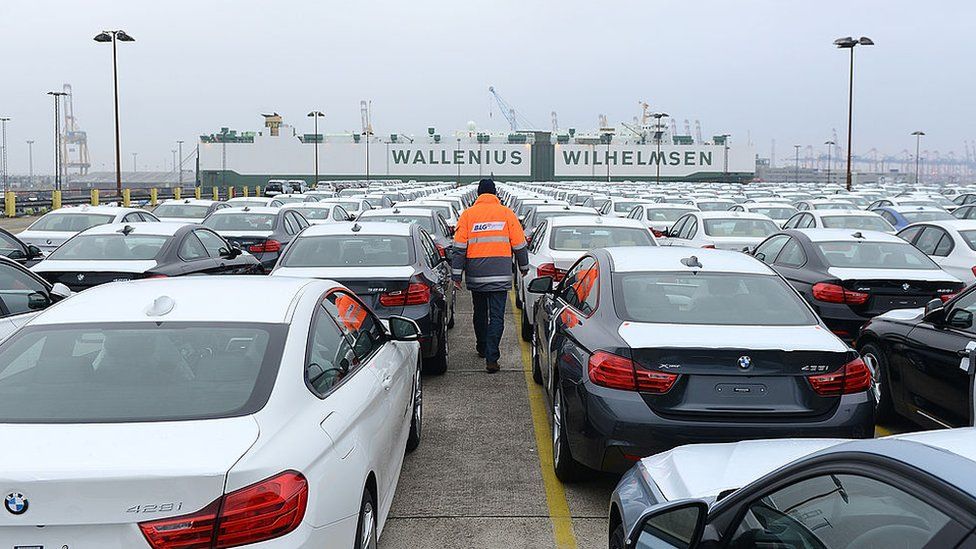 BMW cars waiting to be loaded onto a ship