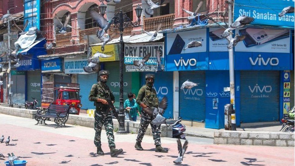 Indian paramilitary soldiers patrol the streets of Srinagar, India, 25 May 2022.