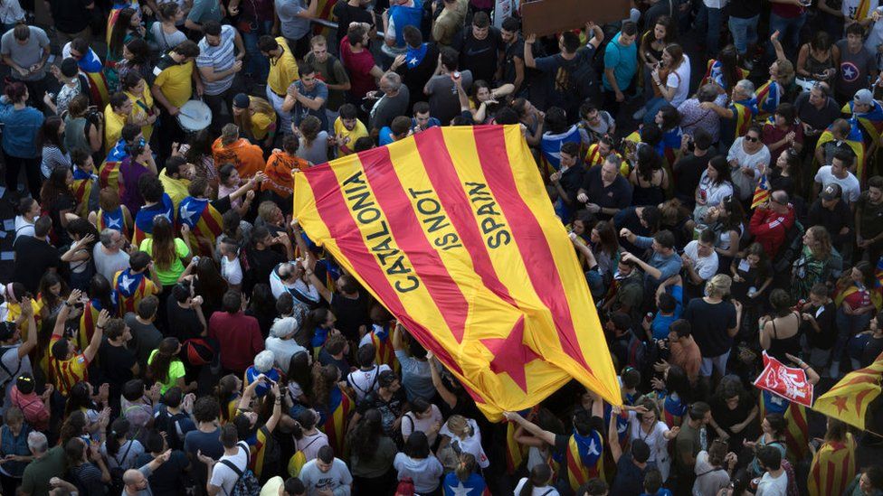 "Catalonia is not Spain" flag held up by protesters