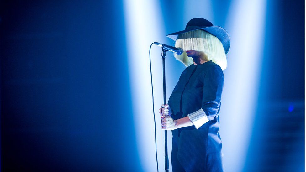 Sia performing on stage