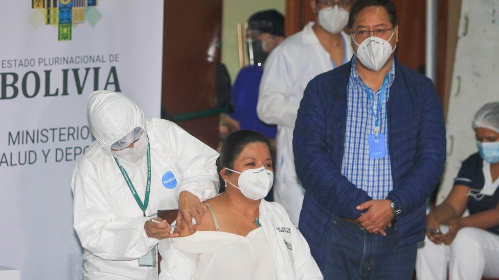a nurse receives the Russian vaccine in Bolivia