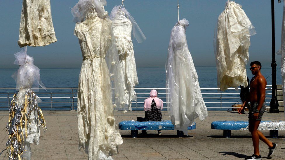 Wedding dresses hung on the Beirut sea front