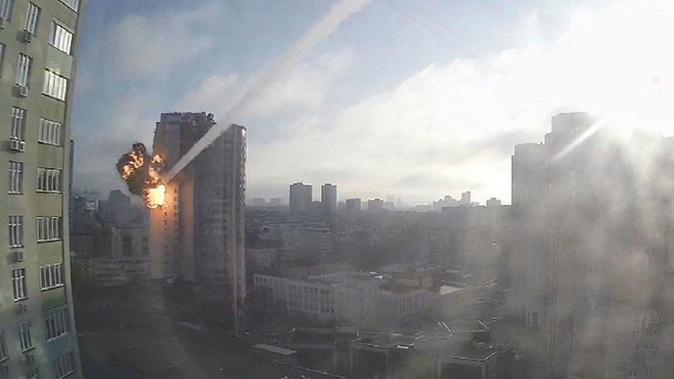 Surveillance footage shows a missile hitting a residential building in Kyiv, Ukraine, February 26, 2022, in this still image taken from a video obtained by REUTERS.