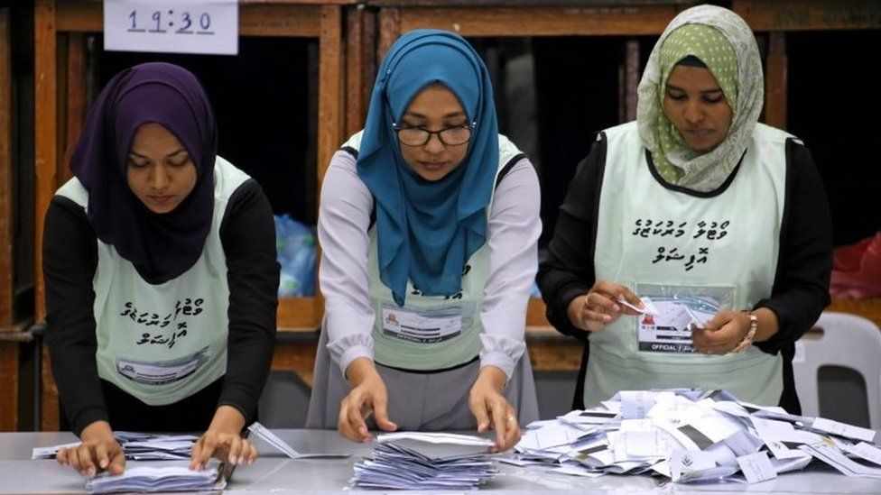 Maldives election commission officials prepare ballot papers for counting votes at a polling station at the end of the presidential election day in Male, Maldives on 23 September 2018.