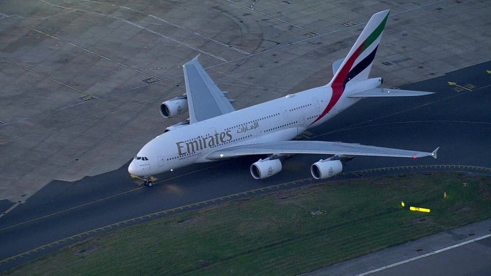 An Emirates plane on the runway at Gatwick